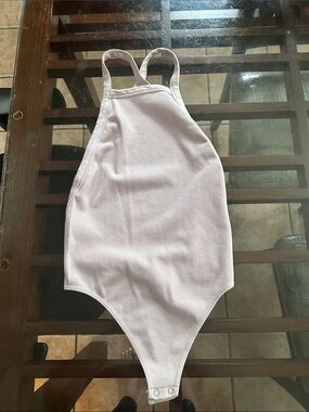 lilac low back cross cut bodysuit